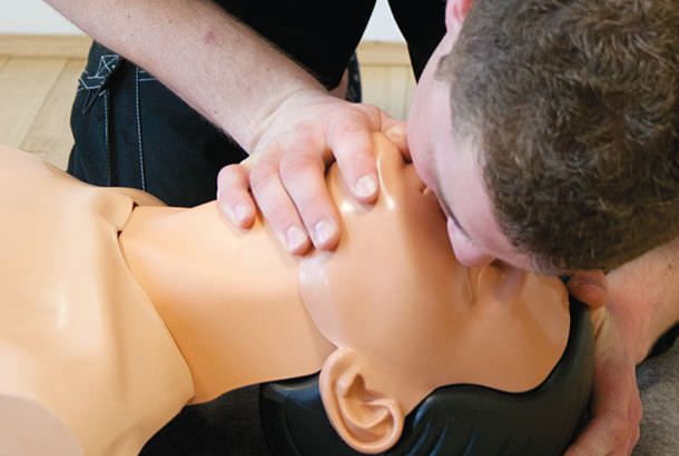 CPR training manikin / with automatic external defibrillator Ambu® SAM Ambu