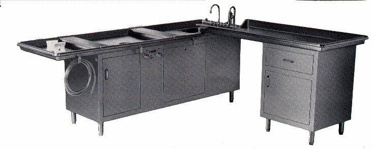 Autopsy table / L-shaped / with sink / height-adjustable DL Deluxe CSI-Jewett